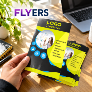 Glossy black and yellow custom flyers photographed on a creative desk